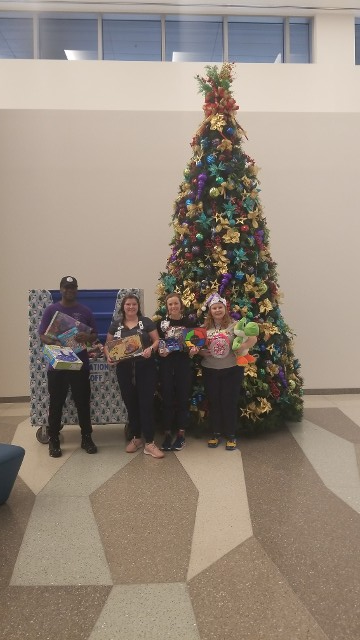 Man and the Three Ladies near the Christmas Tree